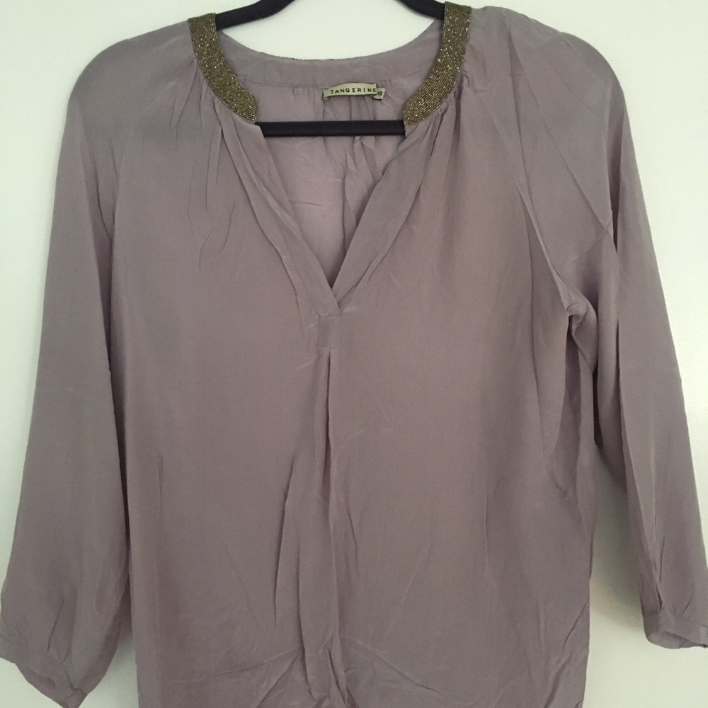 Adorable purple beaded top.